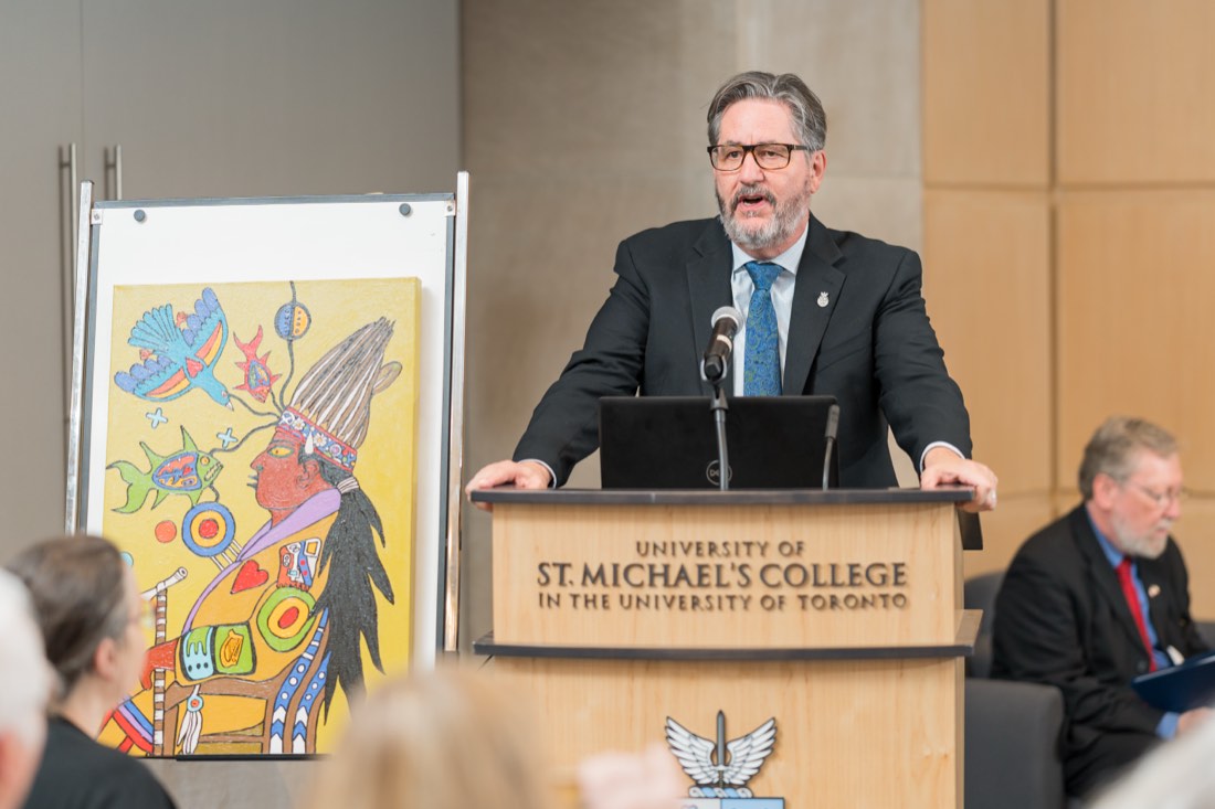 Speaker at a podium during a corporate event