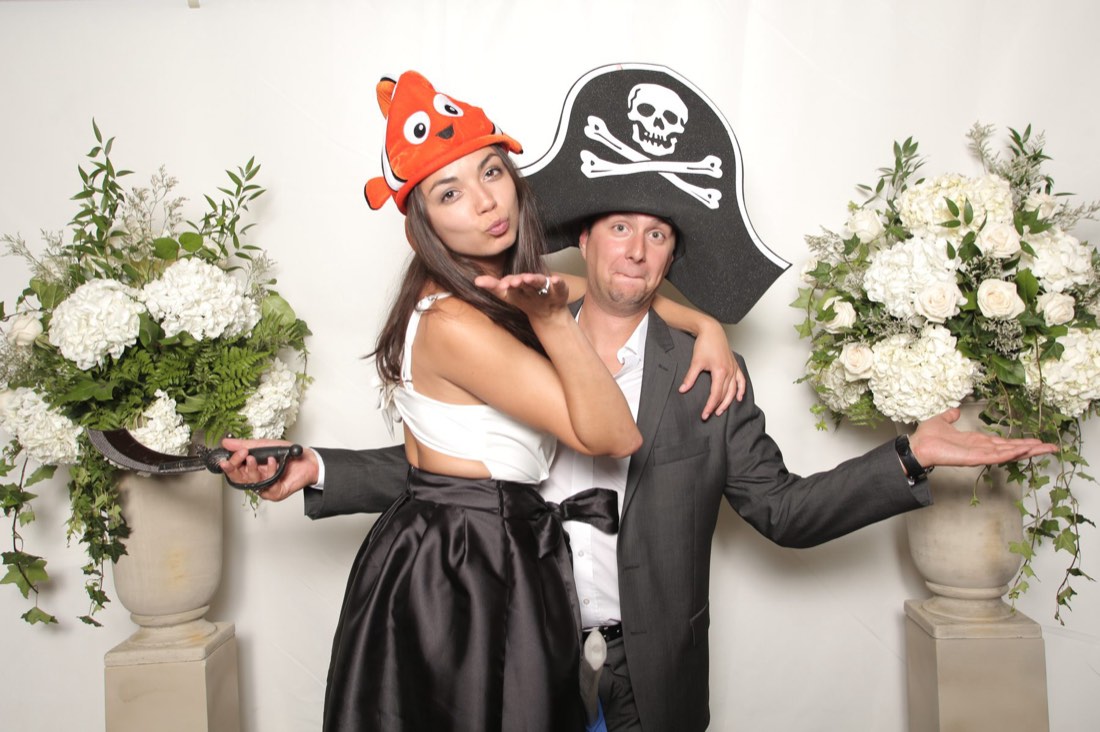 Wedding guests with pirate and clownfish photo booth props
